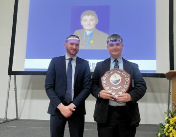 John Mc Groggan collects the Kane Shield also known as Spirit of the Year Award